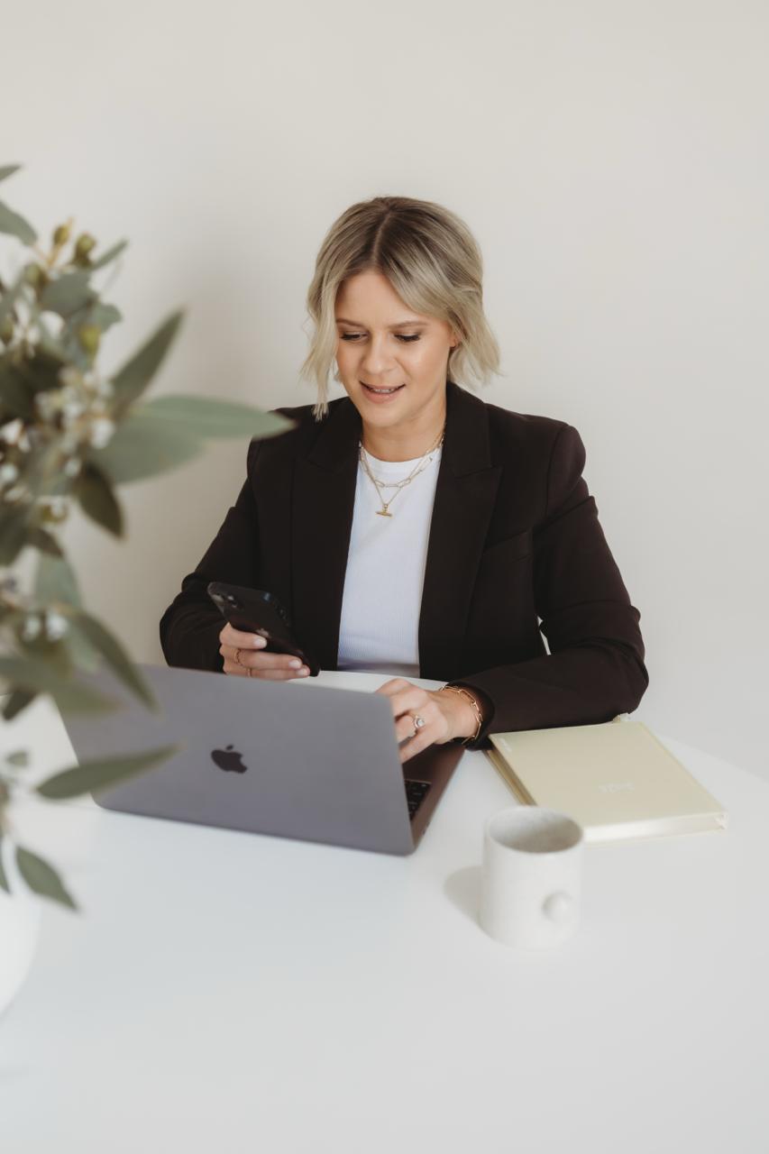 Larissa Elliott at her desk in a professional setting